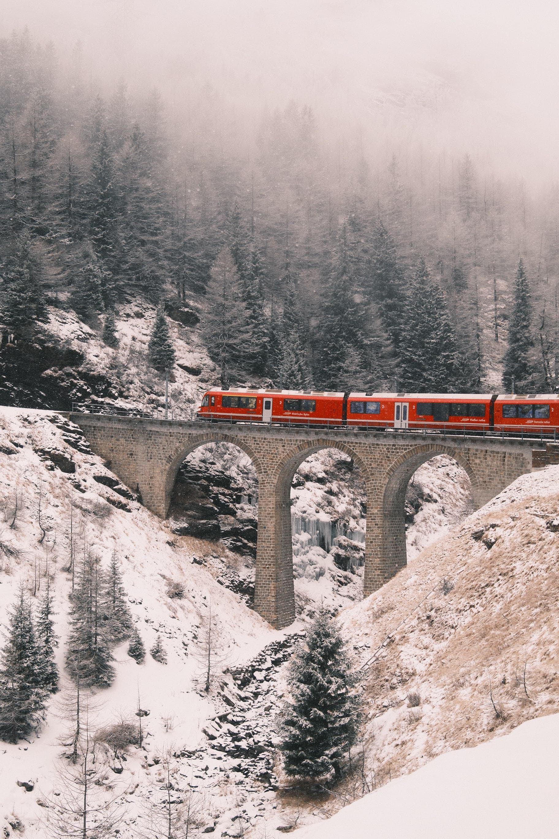 Red train on snowy Bernina pass